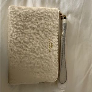 Coach corner zip wristlet. Chalk color